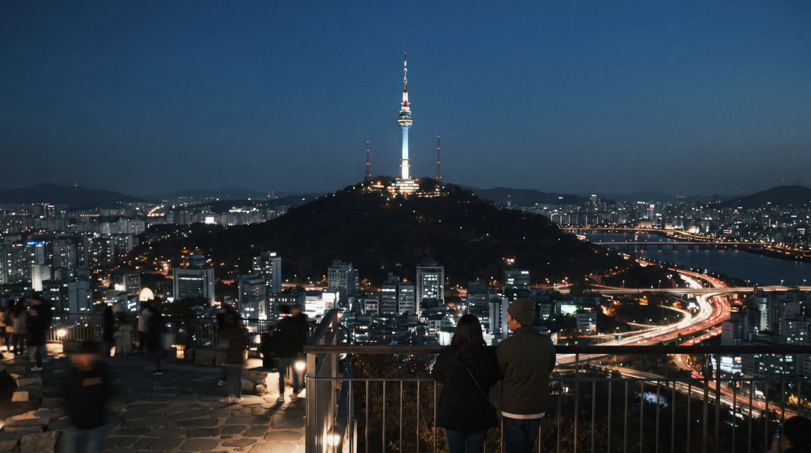 N Seoul Tower lit above Namsan with the city spread out below at blue hour, Seoul, South Korea