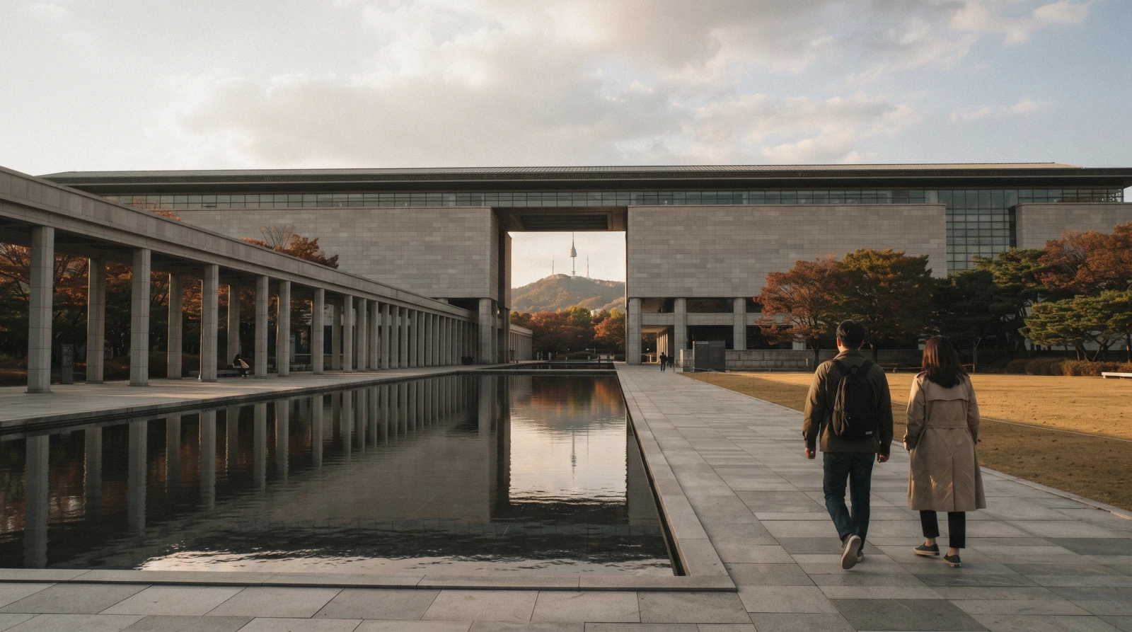 The long horizontal facade and reflecting pool of the National Museum of Korea with Namsan beyond, Seoul, South Korea